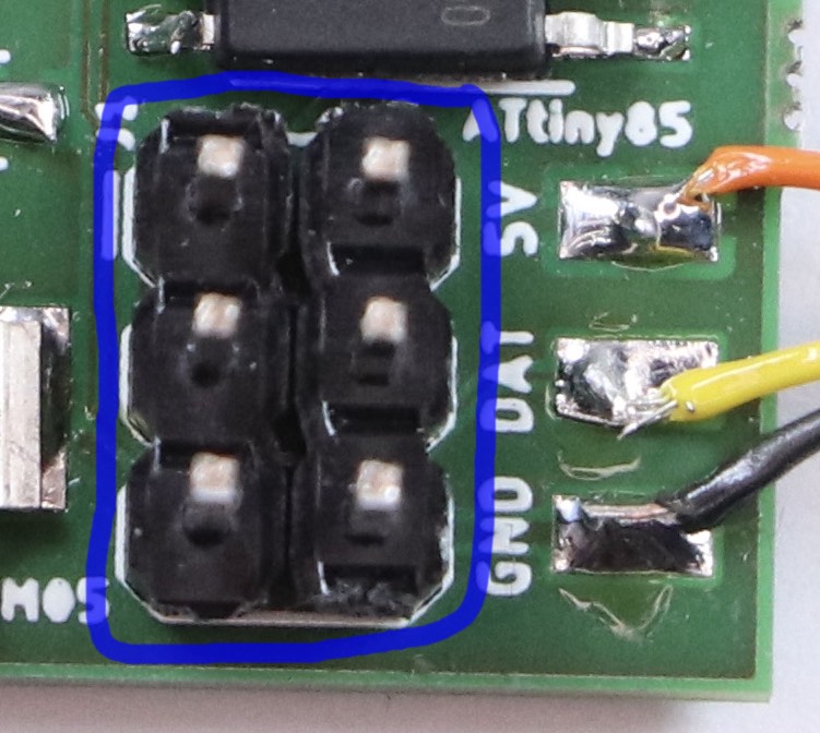 Excerpt from the photograph of the circuit board. The six pin plug is highlighted.